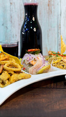 ceviche, chicharrón de pescado and arroz chaufa with chicha morada. peruvian food