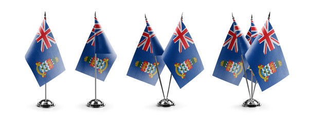 Small national flags of the Cayman Islands on a white background - obrazy, fototapety, plakaty