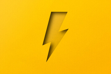 yellow paper cut into holes Lightning bolts are overlaid with light and shadow.