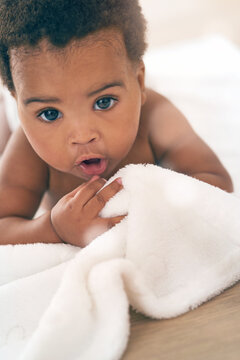 Cute Baby, Black Child And Crawling On Blanket For Play, Fun And Relax In Nursery Room. Adorable Young African Infant Kids, Girl And Face Of Healthy Development, Growth And Learning To Crawl In House