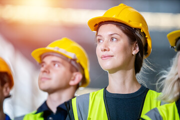 Close up woman engineer, Team engineering worker technician, workshop manufacturing, Teamwork in...