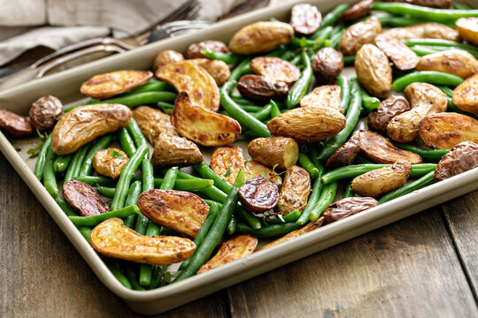 Roasted Crispy Fingerling Potatoes With Green Beans On A Sheet Pan