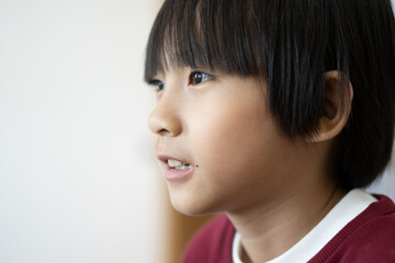 Close up portrait of Asian boy concept with copy space and selective focus.