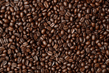 Fototapeta premium photo macro close up texture of roasted coffee beans dark, can be used as a background.