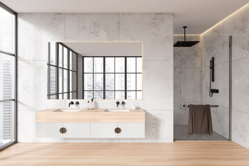 Light bathroom interior with double sink and douche, panoramic window