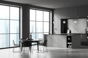 Grey kitchen interior with dining and cooking zone with bar island, window