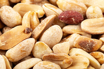 Peanuts are scattered as a background. Healthy protein snack.