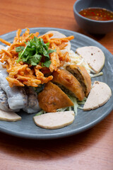 A view of a plate of banh cuon nhan thit.