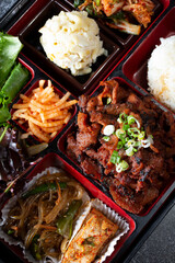 A top down view of a Korean bento box. 