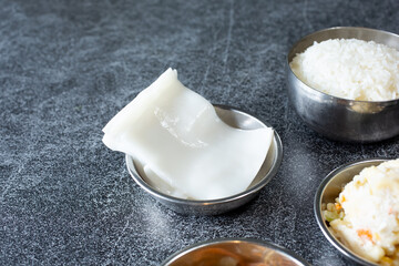 A view of side dish of rice paper.