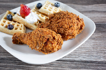 A view of a plate of chicken and waffles.