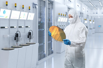 Worker or engineer wears medical protective suit or coverall suit with silicon wafer