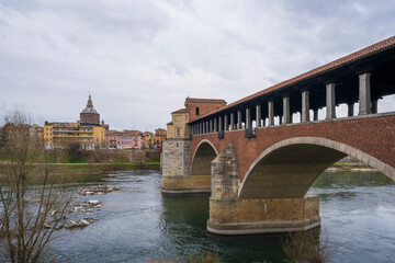 Naklejka premium Bridge over Ticino river in Pavia at overcast day