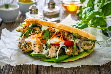 Kebab - grilled meat, bread and vegetables on wooden table
