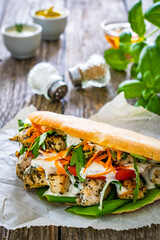Kebab - grilled meat, bread and vegetables on wooden table
