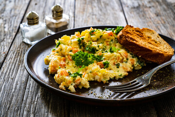 Vegetable mayonnaise salad with hard boiled eggs on white table
