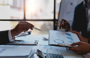 Group of business people meeting for business plan Analyze corporate growth graph and chart.