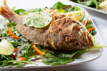 A view of a fried fish entree.