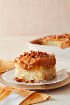 Close-up of cake slice served in plate on table against wall at home
