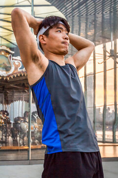 Male runner finishes training run at Carousel in Brooklyn Bridge Park