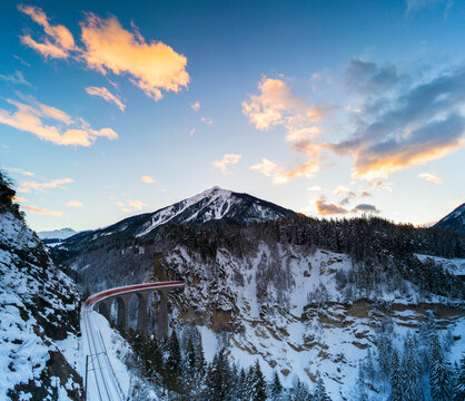 Bernina Express train at sunrise, Filisur, Switzerland