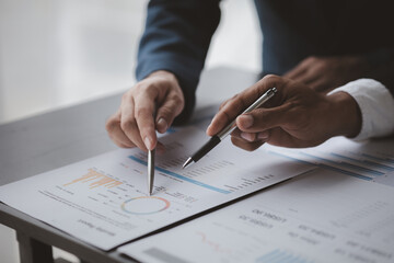 Fototapeta premium The sales department is having a monthly summary meeting to bring it to the department manager, they are verifying the correctness of the documents that are prepared before bringing in to the manager