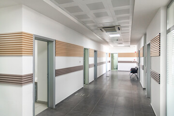 Fototapeta na wymiar Empty modern office corridor with diminished perspective and no people