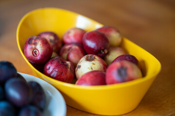 bowl of fruit, plums and apricot