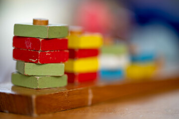 Obraz na płótnie Canvas toy wooden blocks stacked up in australia. childrens coloured toy blocks 