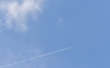 Passenger jet plane at high altitude flying off to destinations unknown. 