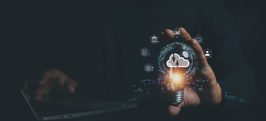 Business  hand using lamp with virtual popup icon of cloud computin Storage and data transfer Cloud...