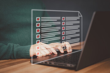 Man using a laptop with virtual screen contact questionnaire with checkboxes. Assessment knowledge...