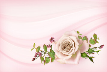 Pink rose flower and green eucalyptus leaves in a floral arrangement on pink background