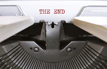 Typewriter with text typed THE END, concept of work finish, last page of book, script, screenplay...