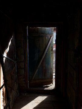 Exit from the old barn.  Old wooden door.