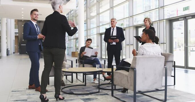 Making wise business decisions as a team. 4k video footage of businesspeople having a meeting in the workplace.