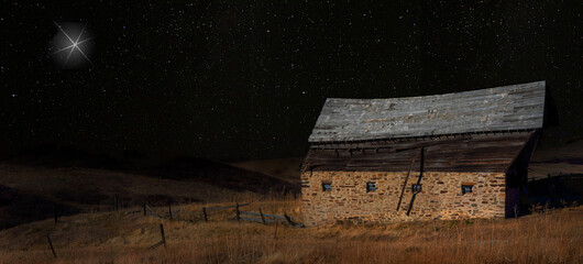 Fototapeta na wymiar Old stable with a bright star overhead