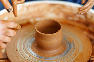 Cropped Image of hands working with Pottery Wheel, education classes