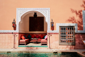 Oriental hospitality. Traveling by Morocco. Relaxing in festive moroccan traditional riad interior...