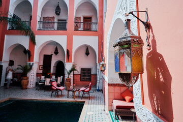Oriental hospitality. Traveling by Morocco. Relaxing in festive moroccan traditional riad interior.