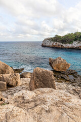 Fototapeta na wymiar Cliffs, beaches and coves in the south of the island of Mallocar in the Balearic Islands in Spain. Mediterranean coast.