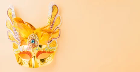 Gordijnen Happy Purim carnival decoration. Jewish Purim and Mardi Gras in Hebrew, celebration holiday background banner design, Golden venetian ball mask, carnival mask isolated on pastel background © sorapop