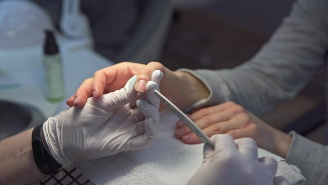 A beauty salon customer gets a manicure