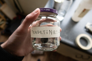 a glass pot in a kitchen filled with Turpentine