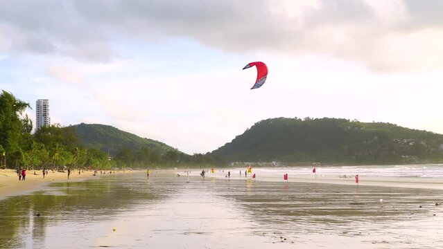 Parasailing sports beach relax slow motion flying sky during sunset mountain island.	