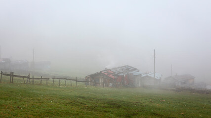 a village house in the fog