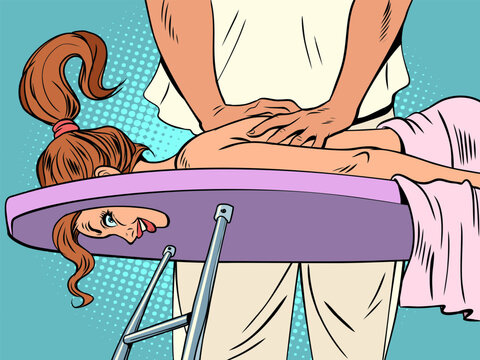 Taking care of your health. Salon of high-quality and professional massage. Woman on a massage table, hands of a male massage therapist.