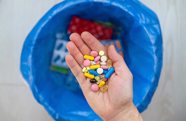 Throw tablets in the trash. Selective focus.