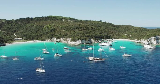 Aerial view of yacht boats achored at most beautiful beaches of Greece - Vrika in Antipaxos. Ionian islands