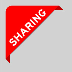 Red color of corner label banner with word sharing on gray background